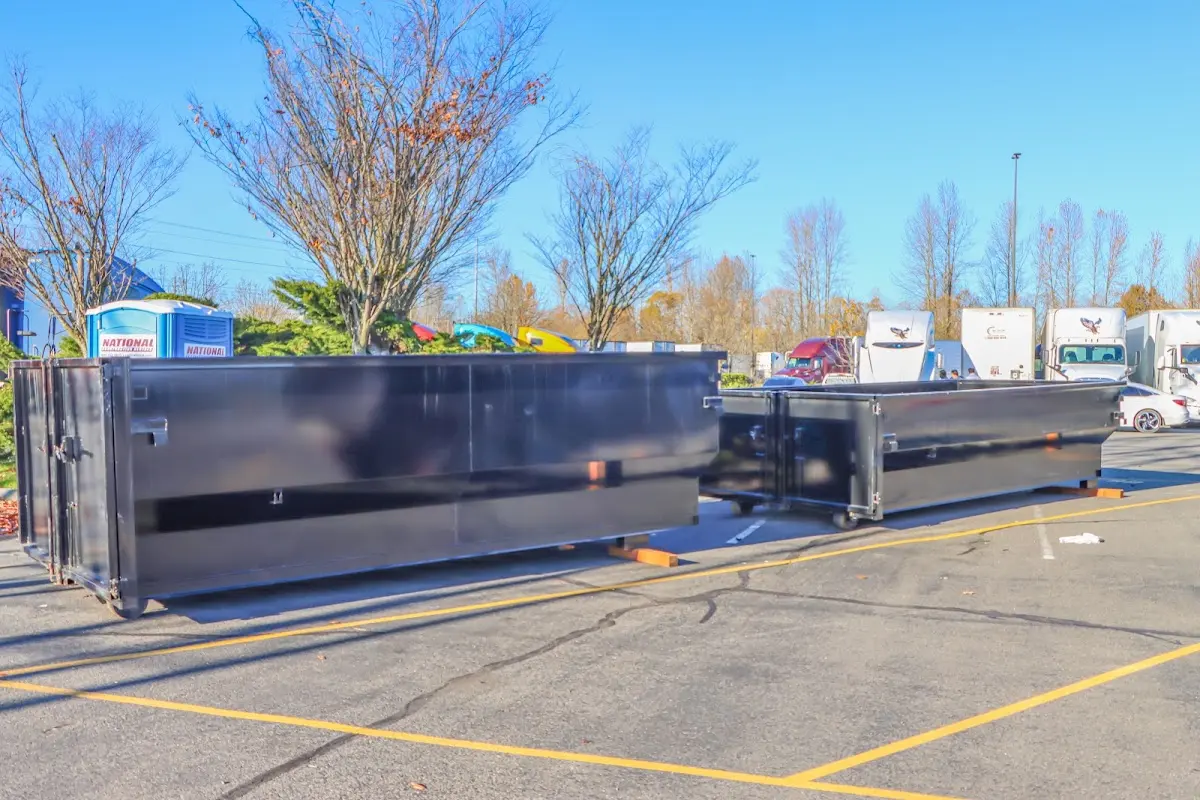 Professional dumpster rental service with roll-off container on residential driveway in Santa Rosa